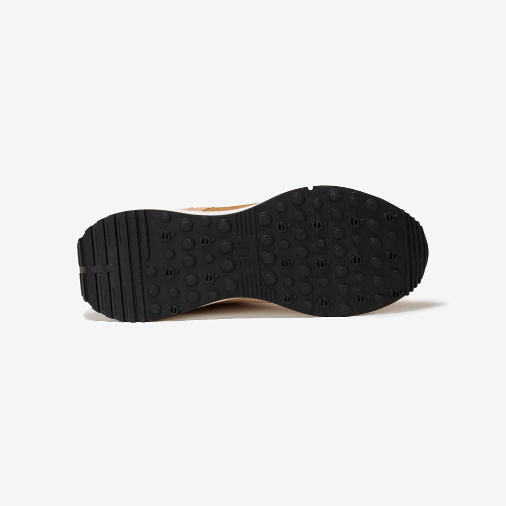 Semelle des sneakers vegan unisexes beige et noir